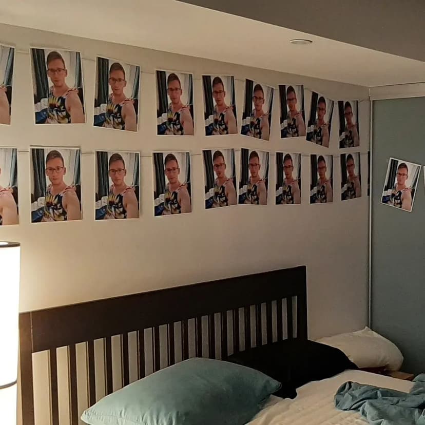 My room covered in pictures of me in a unicorn tank top